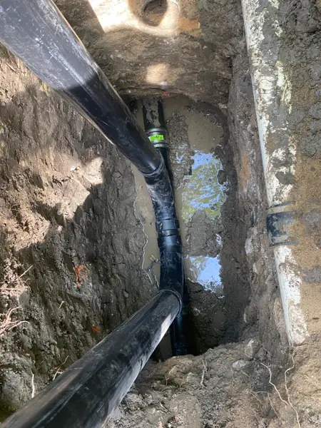 Two-way 4-inch sewer cleanout being installed in an open trench in Encino